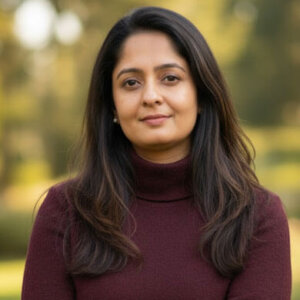 Portrait of Dr. Rupali Panse Rupali, an HUA Ayurveda faculty member, in a purple dress.